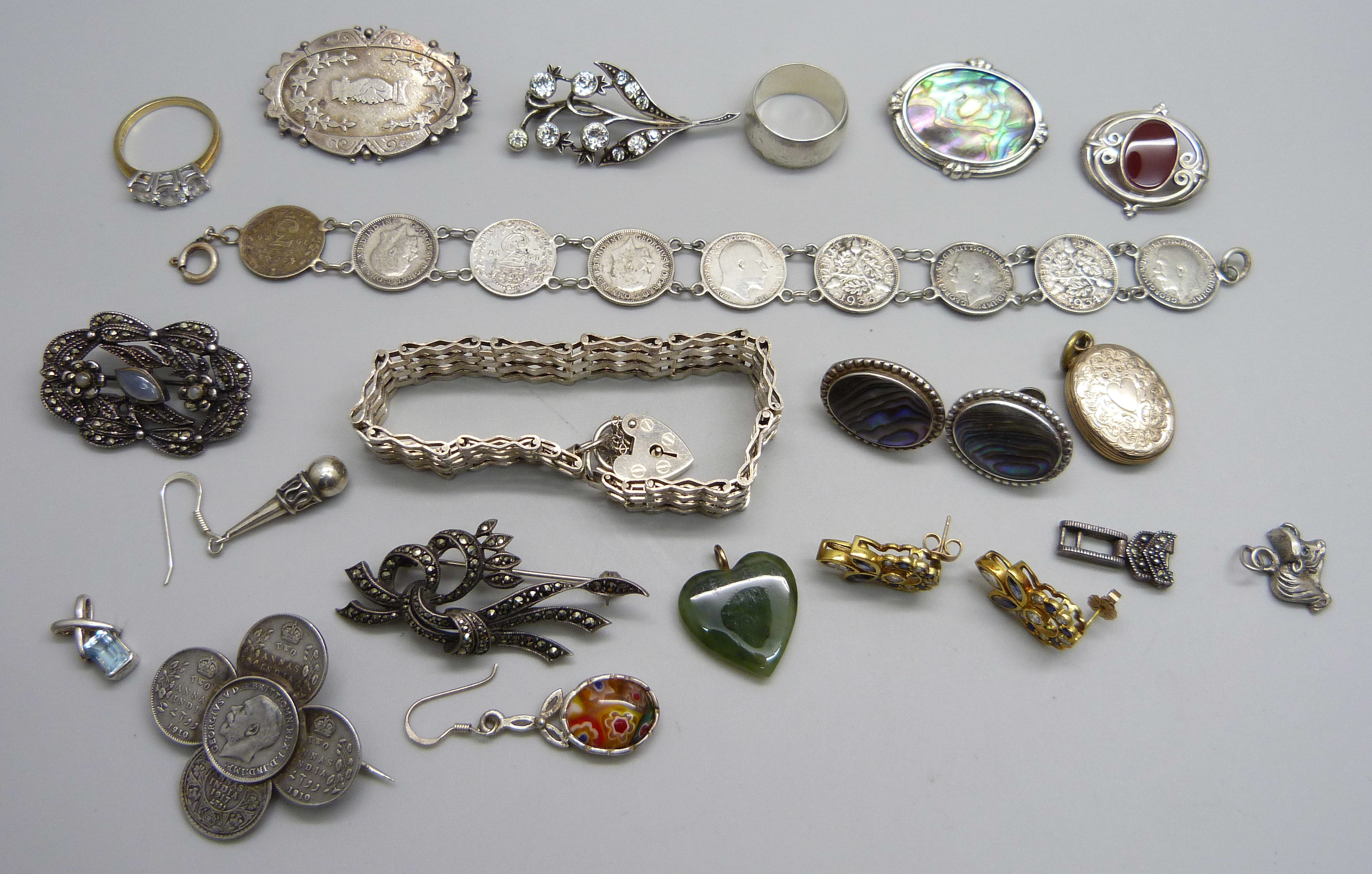 A collection of jewellery including silver