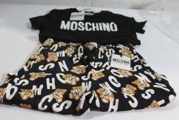 A Moschino Kid black with teddy bear print shorts