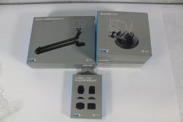 A GoPro Boom + Adhesive Mounts, two GoPro Suction