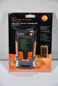 An as new Testo 552 Digital cacuum gauge with blue