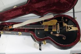 A boxed as new Gretsch G6136TG Falcon MS Electric Guitar - Midnight Sapphire.