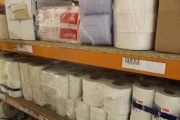 Two shelves of disposable work/cleaning rolls.
