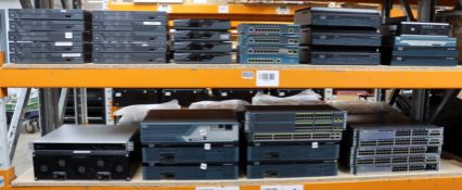 A large quantity of pre-owned Cisco switches and other hardware (All in good, used condition. Two sh