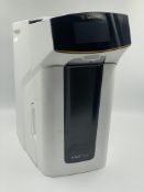 A pre-owned Sartorius Arium Mini Plus Water Purification System (P/N: H2O-MA-UV-T) with power adapto