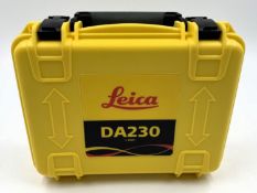 A pre-owned Leica DA230 1 Watt Signal Transmitter with battery, charger and Leica testing confirmati