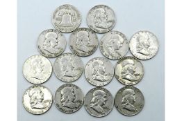 A lot of 14 different-date USA 90% silver Franklin Half Dollar coins, ranging from 1948-62.