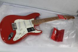 An as new Fender Player Stratocaster, Maple Fingerboard, Candy Apple Red.