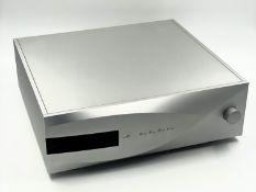 A pre-owned dCS Vivaldi Digital-to-Analog Converter in Silver with original packaging, power cable,