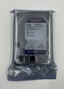 An as new Western Digital Purple 6TB Surveillance Hard Drive (P/N: WD64PURZ-85BWUY0).