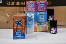 Approximately fifty assorted Skins Condoms and Delay Spray (Over 18s only).