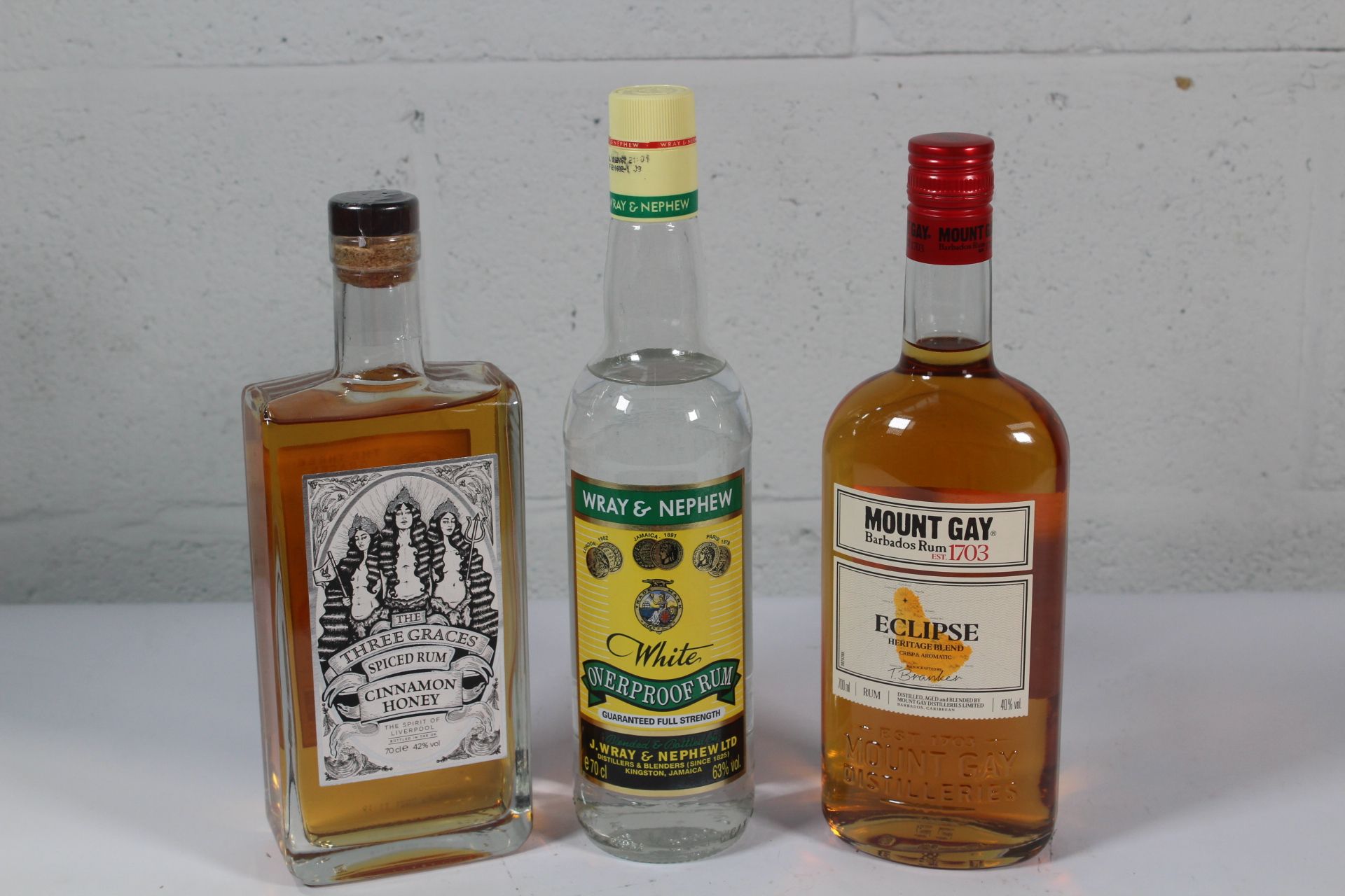 Whay & Nephew White Overproof Rum 700ml, Mount Gay Barbados Rum 700ml and Three Graces Spiced Rum Ci