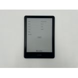 A pre-owned Amazon Kindle Paperwhite 11th Gen 16GB 6" E-Reader in Blue.