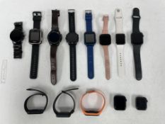 Thirteen pre-owned smartwatches/fitness trackers to include 4 x Apple Watches (Activation locked), 1