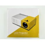 An as new mini LED Projector.