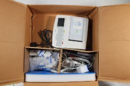 ELI 150c Resting Electrocardiograph with Some Accessories. Pre-owned. Item is untested and may be in