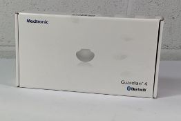 A Medtronic Guardian 4 Transmitter Kit, REF MMT-7840W1. As New and Sealed.