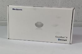A Medtronic Guardian 4 Transmitter Kit, REF MMT-7840W1. As New and Sealed.