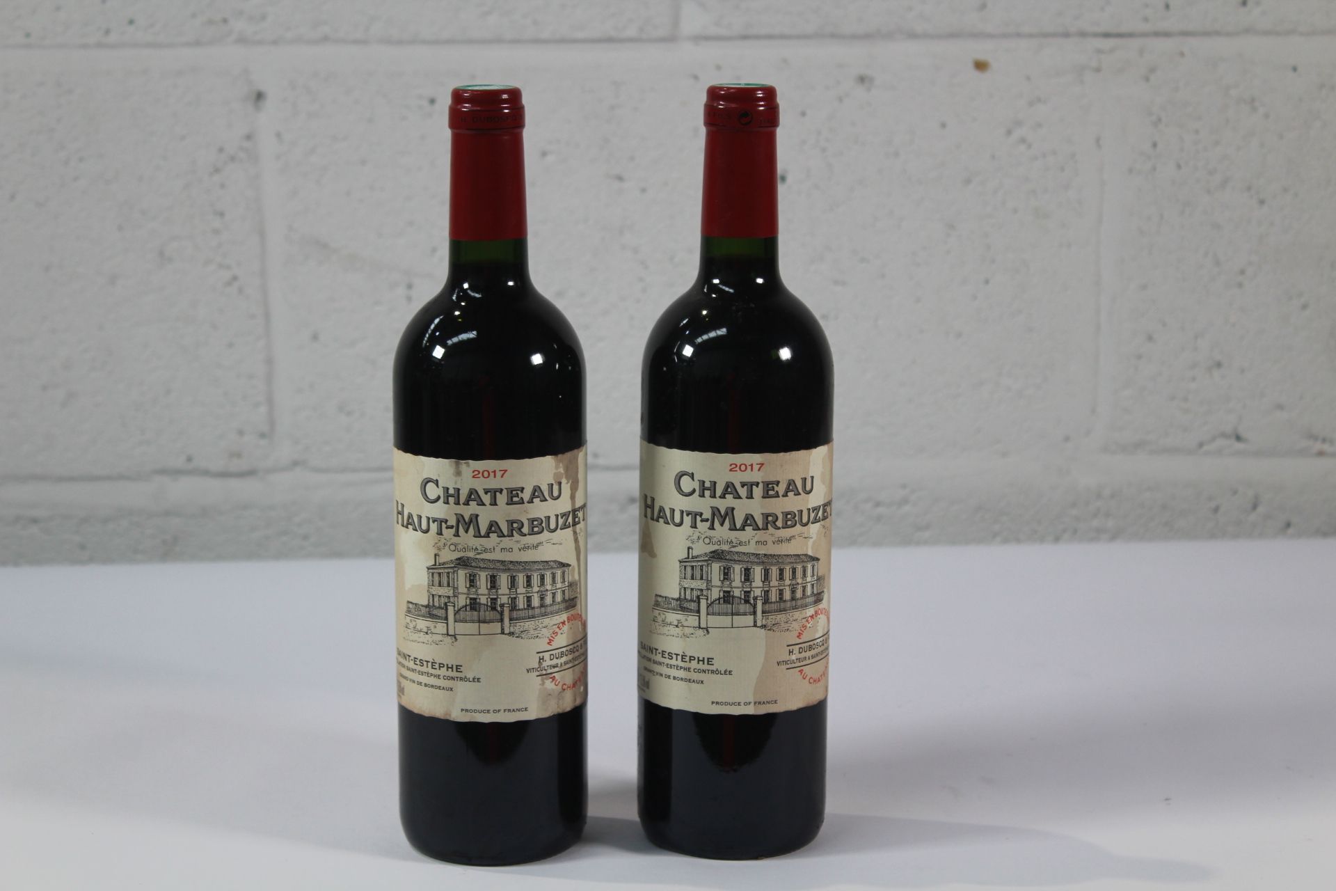 Two Chateau Haut - Marbuzet 2017 Red Wines 2 x 750ml Labels Distressed.