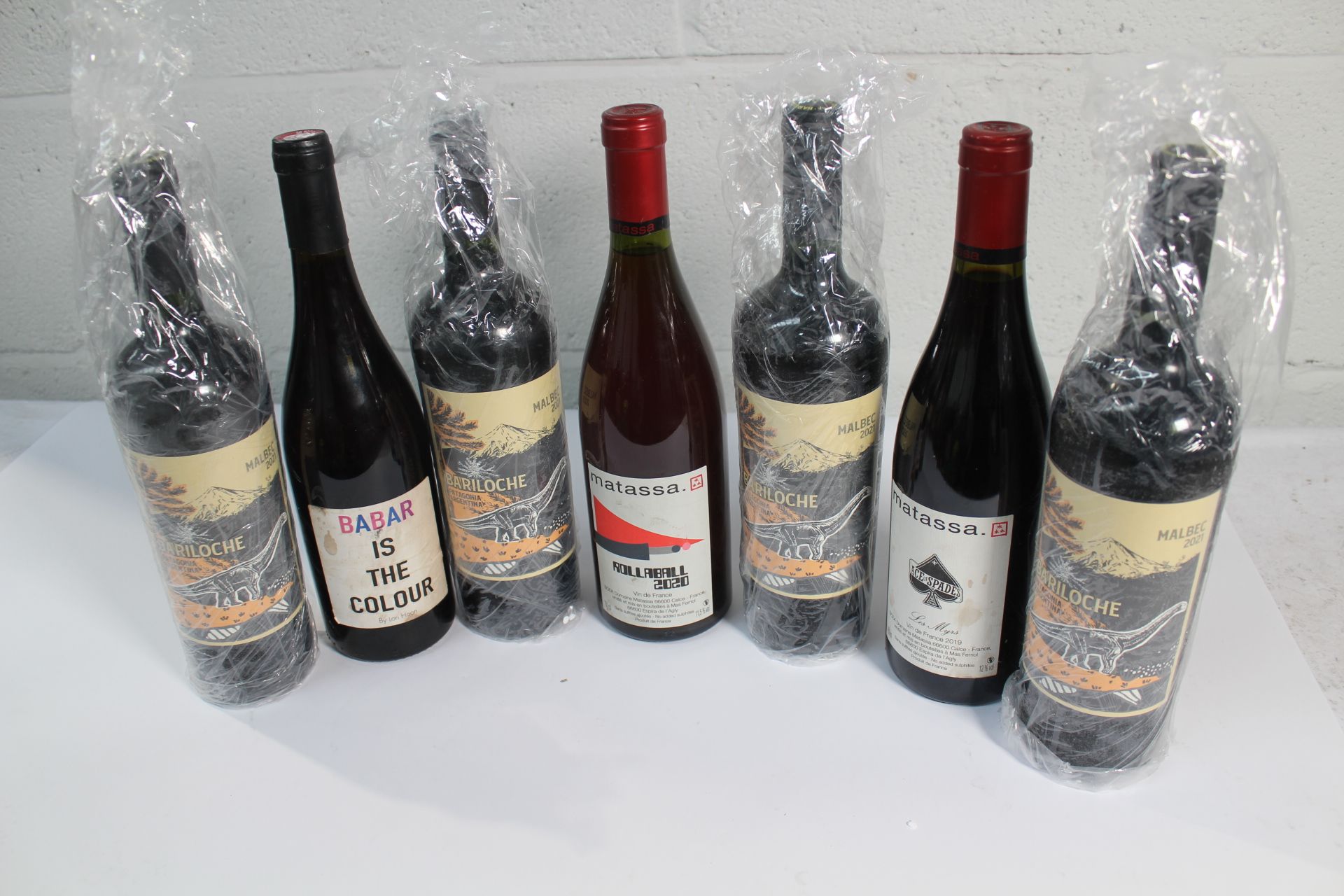 Seven Bottles of Wine to include Bariloche Malbec, Matassa Rose and Babar Merlot.