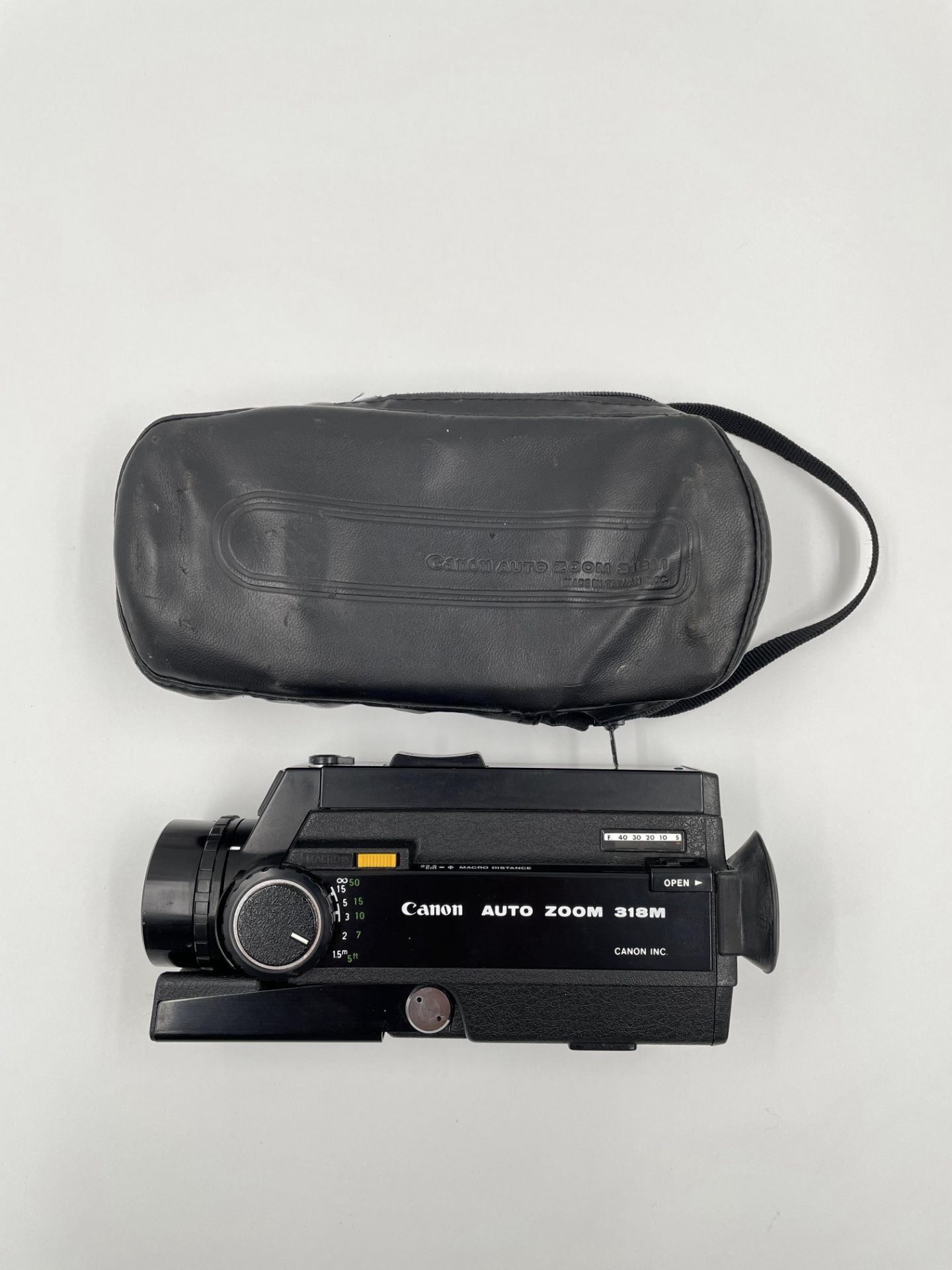 Pre-owned Canon Auto Zoom 318M Super 8 Cine Camera with original storage bag.