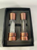 A set of Cole and Mason Derwent salt and pepper mill sets in copper (Damage to box).