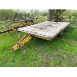 Farm-made Root Engineering flat bed trailer with wooden floor on 10.0/75-15.3 wheels and tyres