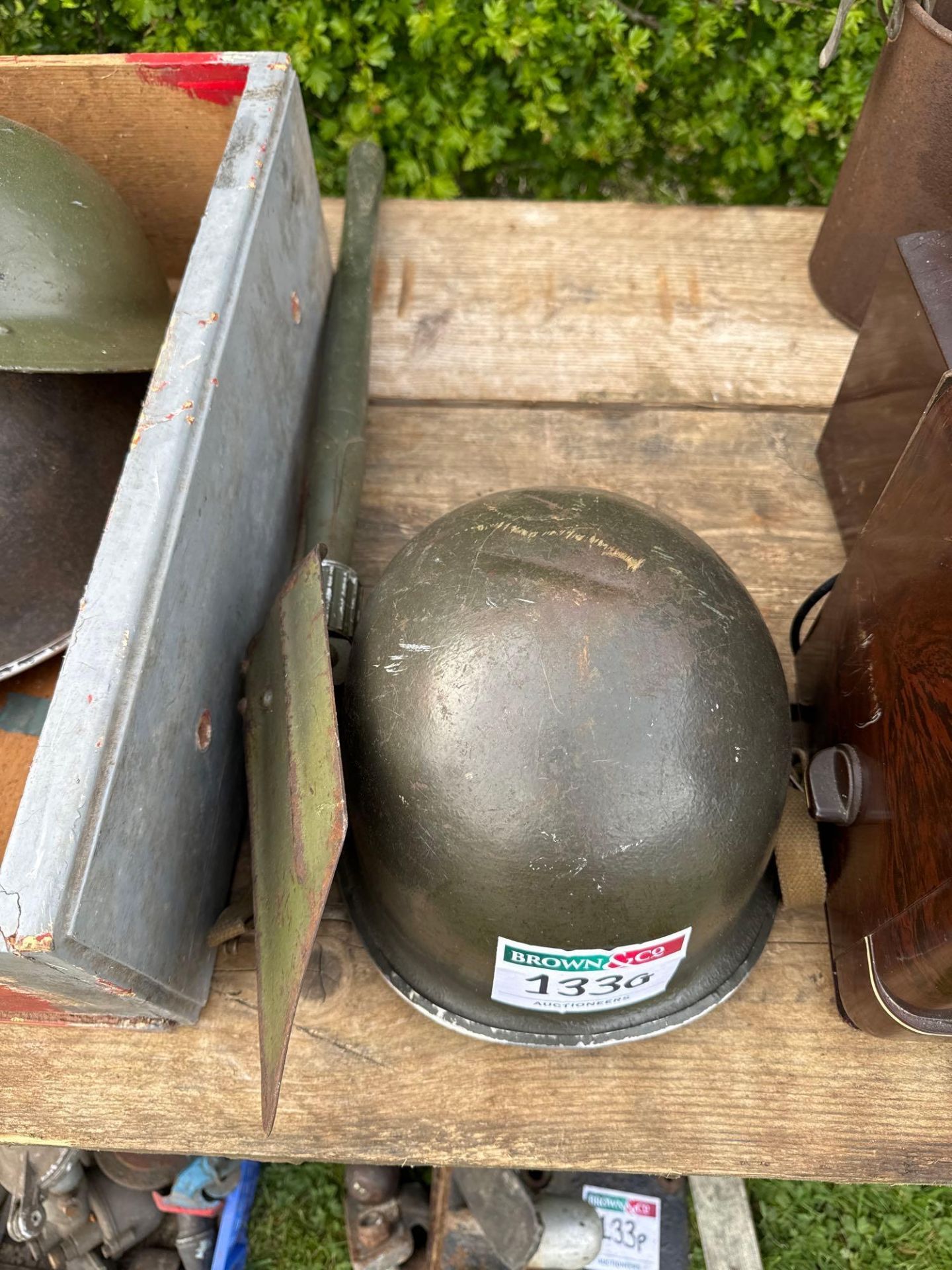 Wartime helmet and folding spade