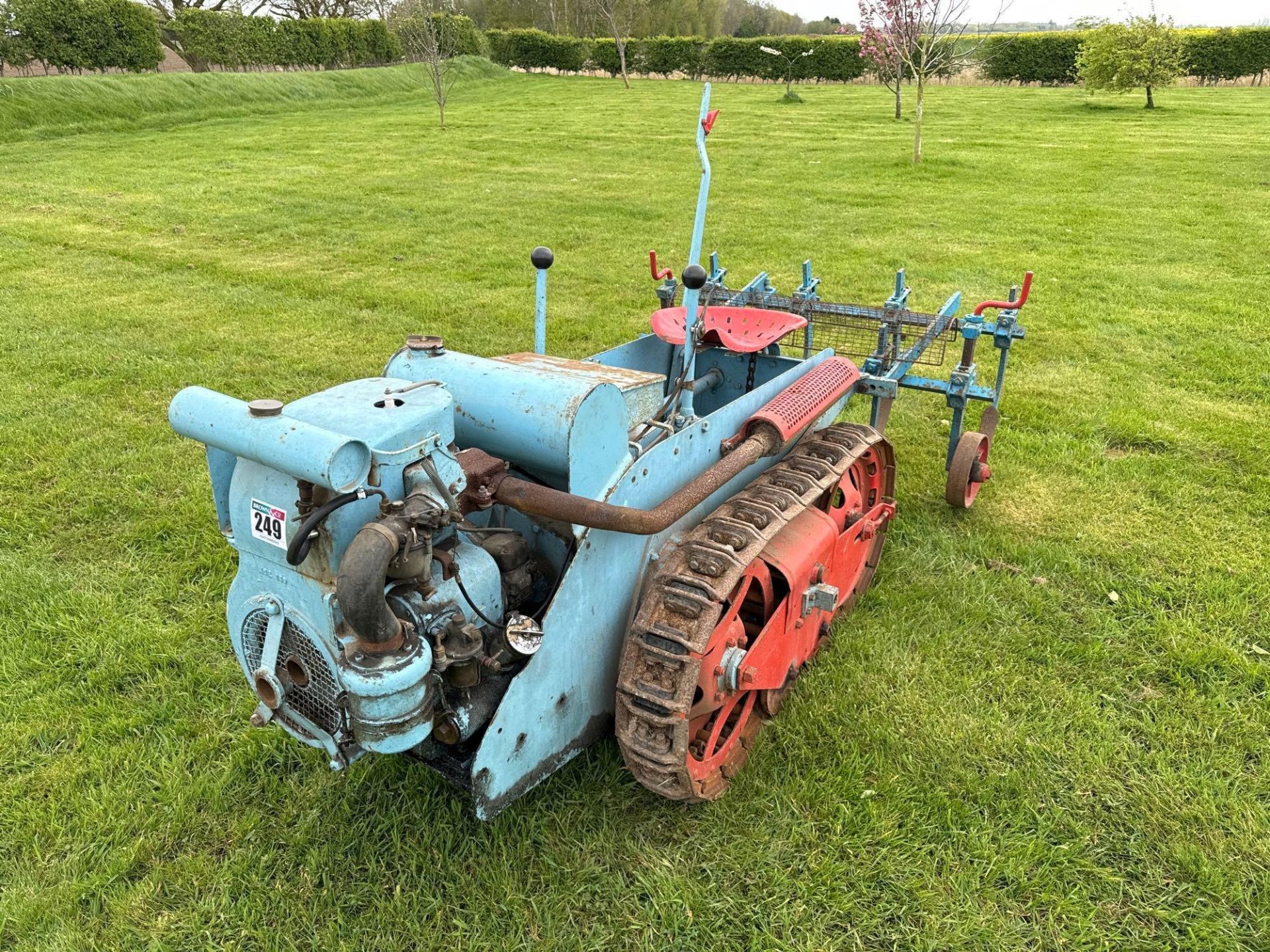 Ransomes MG5 metal tracked crawler with petrol paraffin engine and 4' mounted cultivator