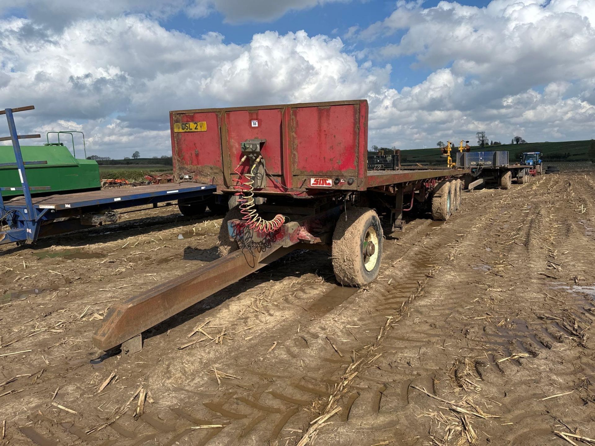 Tri-axle 45ft flat bed bale trailer with air brakes on 385/65R22.5 wheels and tyres with dolly