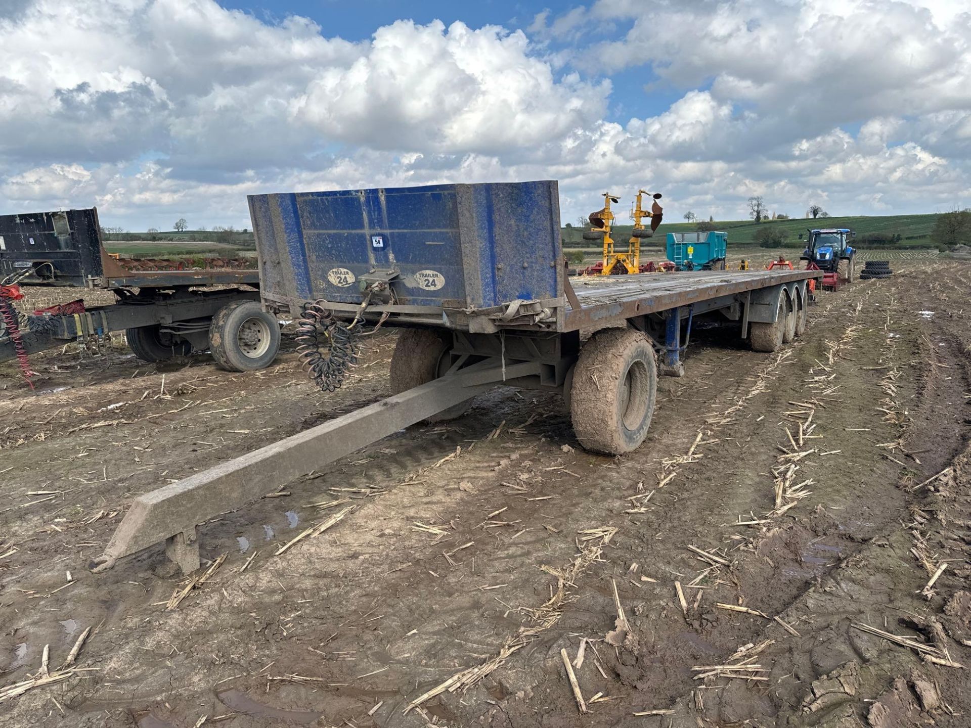 Tri-axle 45ft flat bed bale trailer with air brakes on 385/65R22.5 wheels and tyres with dolly