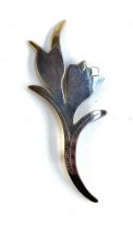 A modernist style silver brooch in the form of a floral spray, silver gilt detail, hallmarked for