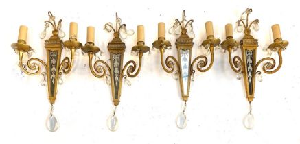 Interior design interest: a set of four gilt metal and cut glass two arm wall sconces, of tapered