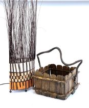 A square basket with twig handle; together with a contemporary floor standing lamp