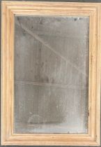 A rectangular pine framed mirror, 65x46cm