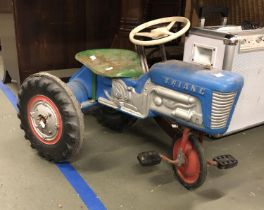 A vintage Triang ride on children's tractor