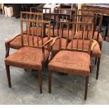 A set of eight mid century dining chairs by Archie Shine, comprising two carvers and six side chairs