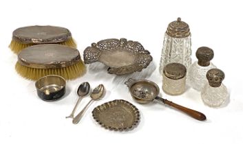 A mixed lot of silver to include two clothes brushes (AF); cherub pin dish; tea strainer; various