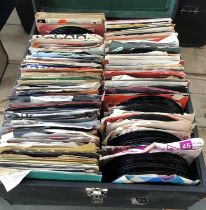 A box of miscellaneous 45s, largely American and Spanish World music from the 50s, 60s, and 70s.