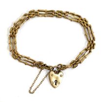 A 9ct gold gate bracelet with heart padlock, gross weight 7.3g