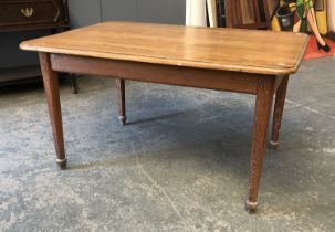 A pine kitchen table, on moulded square section legs, 137x96x75cmH