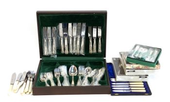A Sheffield stainless steel King's pattern canteen, together with a set of fish knives and forks,