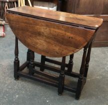 An 18th century oak oval gateleg table, baluster turned supports, 84x40x74cmH