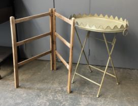 A small wooden towel rail, 77cmH; together with a tole ware tray table, 63cmW