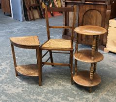 A burr walnut corner occasional table, 50cmH; a three tiered circular whatnot and a caned occasional