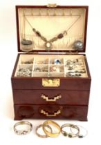 A jewellery box containing a quantity of costume and silvery jewellery, including a Czech Gurtler