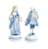 A pair of 19th century porcelain figures of a continental lady and gentleman, blue underglaze R mark