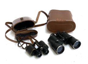 Two pairs of binoculars with cases: one Kershaw, the other Skybolt 7x50