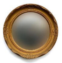 A circular convex gilt frame wall mirror by Atsonea superior products, 42cmD