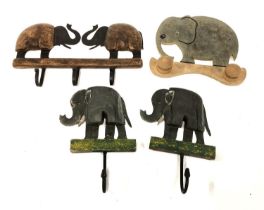 Four vintage elephant coat hooks