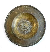 A brass regimental plate, Lincolnshire Regiment, Egypt, with Sphinx to centre, 26cmD
